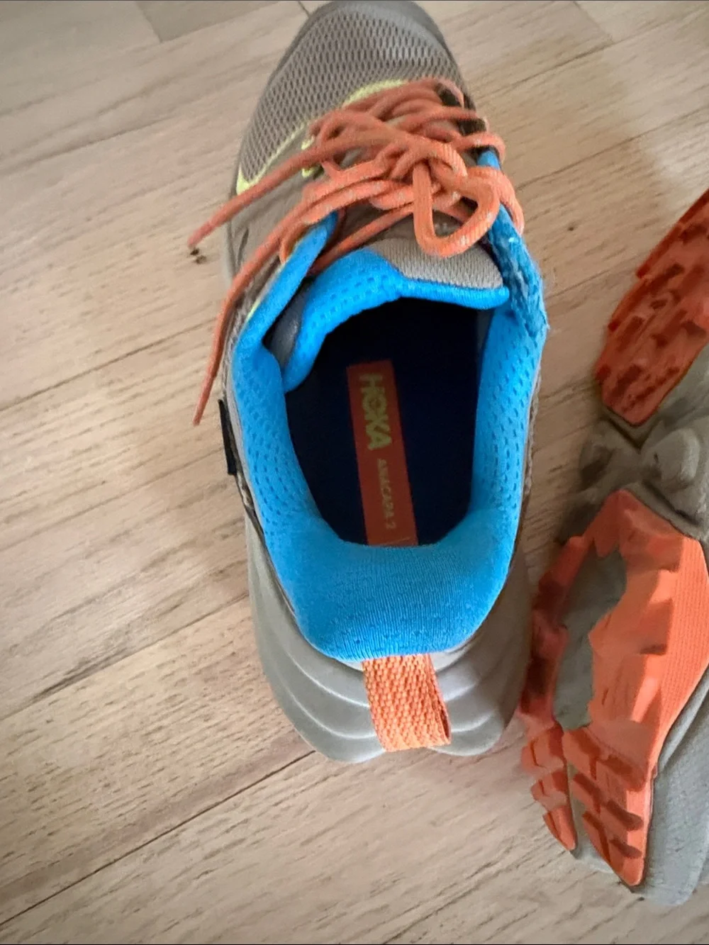Hoka Kids Tan Sneakers with Bright Blue Lining and Orange Laces